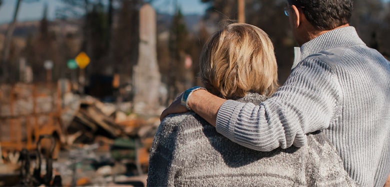 Middle aged couple reflecting on the recent bushfire disaster