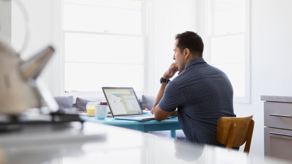 man on laptop dealing with declined loan