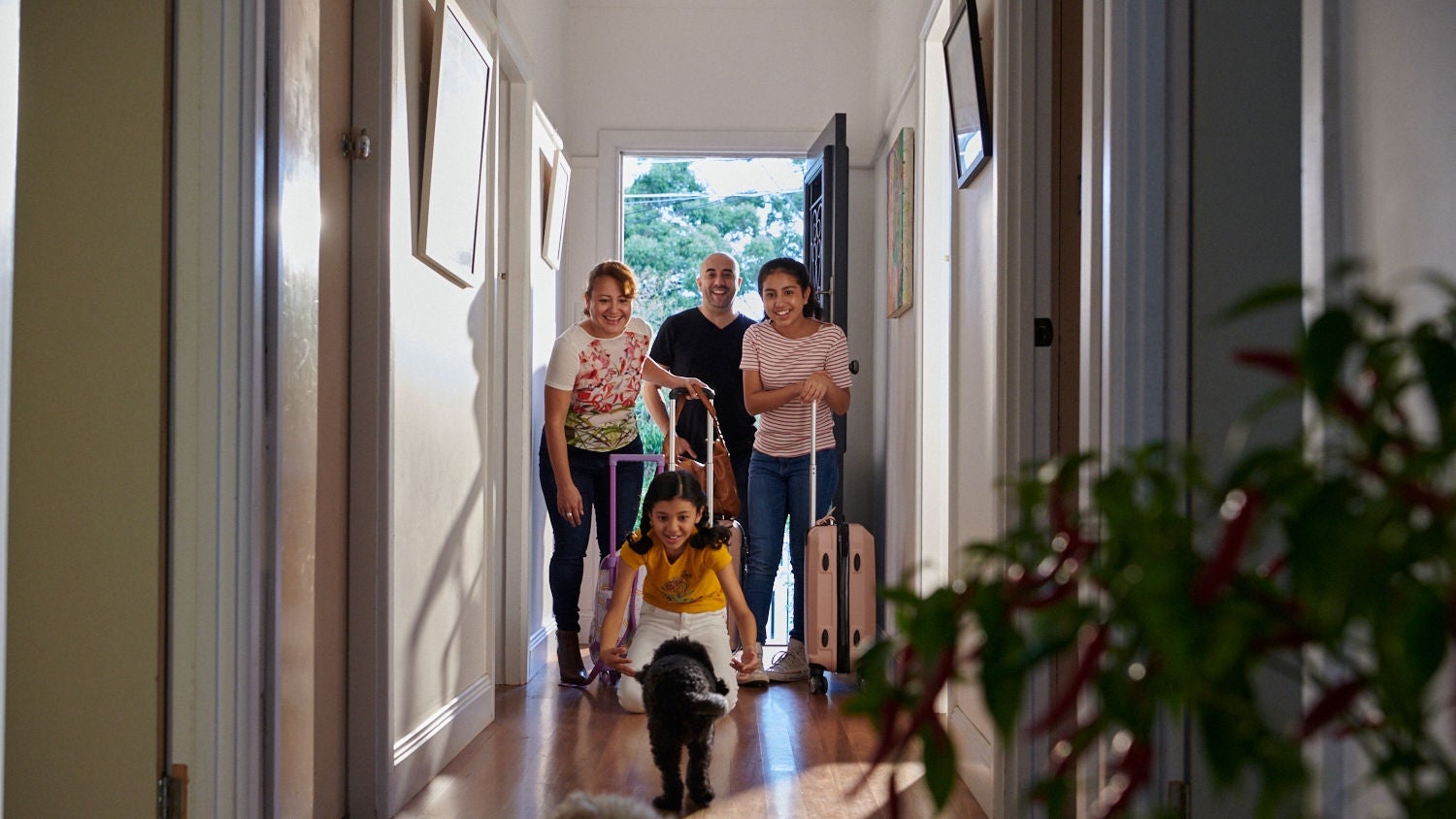 Excited family entering their new home