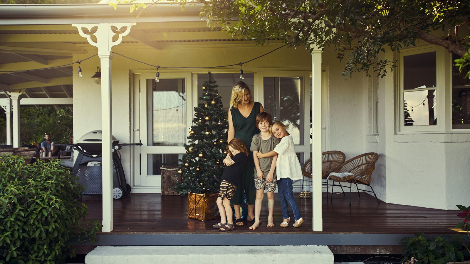 Family in front of their home during Christmas