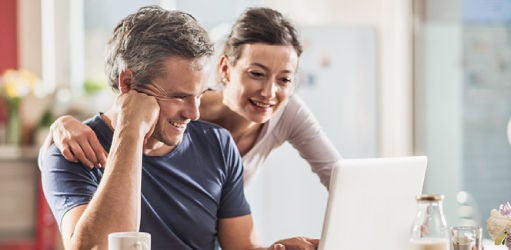 couple reading about how they can improve their credit score