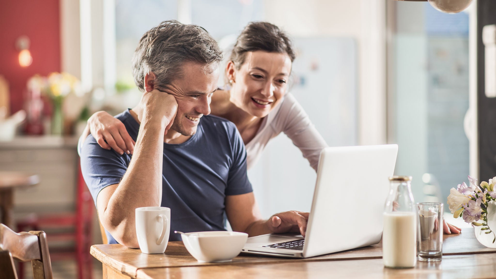 couple budgeting on a laptop