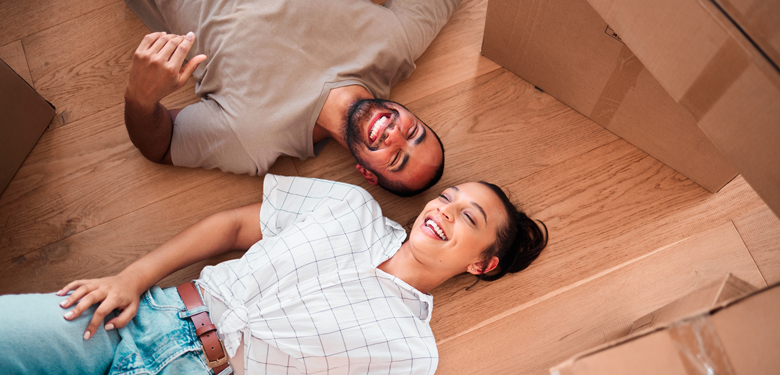 couple taking a rest after moving in to their first home