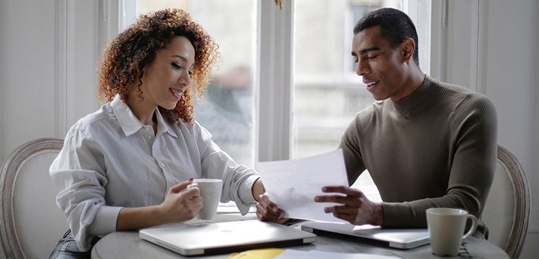 Couple discussing home loan risk fees