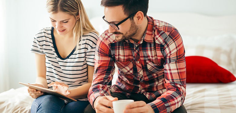 couple securing their online accounts to protect their identity