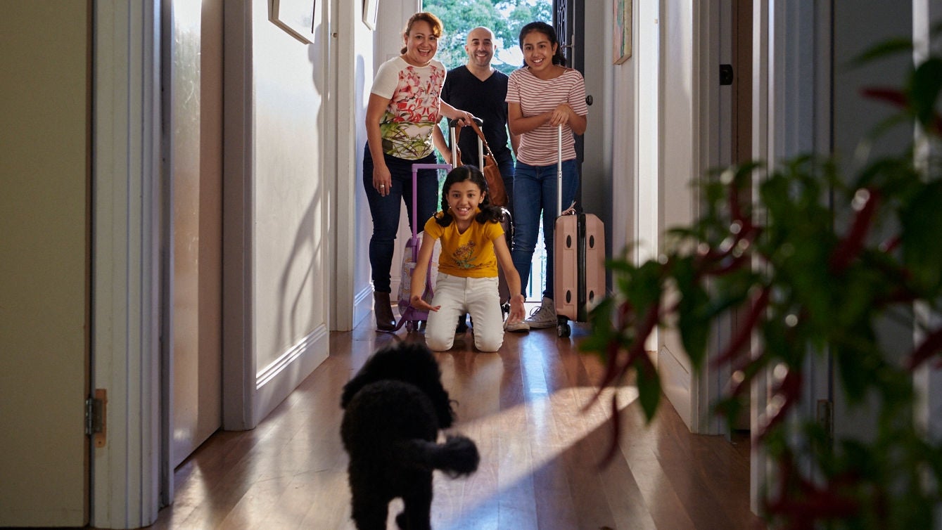 happy family entering their new house 