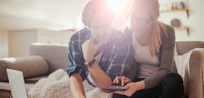 couple looking at their current property value