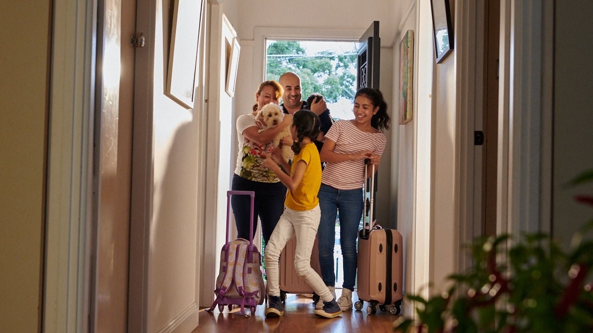 family entering new house